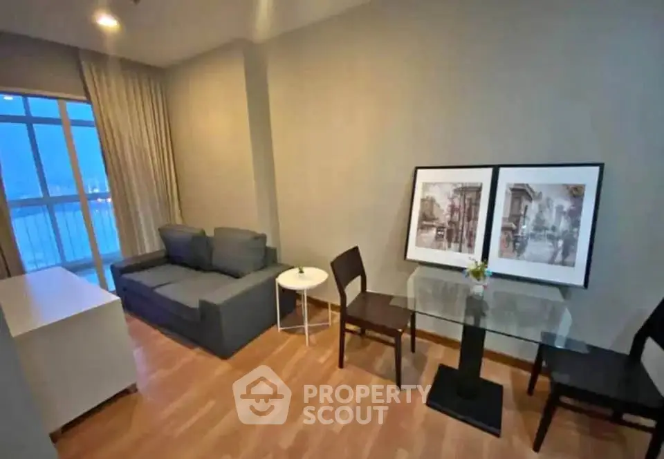 Modern living room with stylish decor and large window view