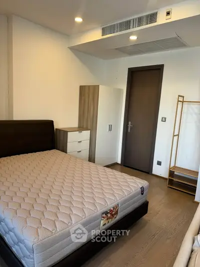 Modern bedroom with stylish furniture and cozy ambiance, perfect for comfortable living.