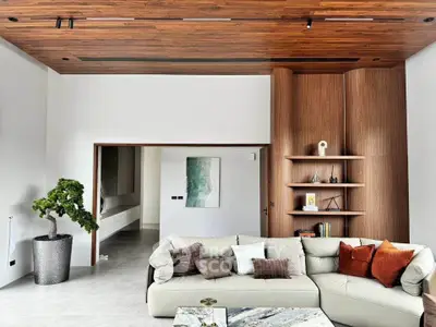 Luxurious modern living room with stylish wooden ceiling and elegant decor