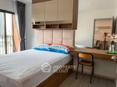 Modern bedroom with stylish decor and balcony view in urban apartment