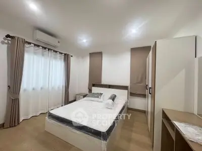 Modern bedroom with sleek design and natural light