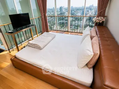 Luxurious bedroom with stunning city view and elegant decor