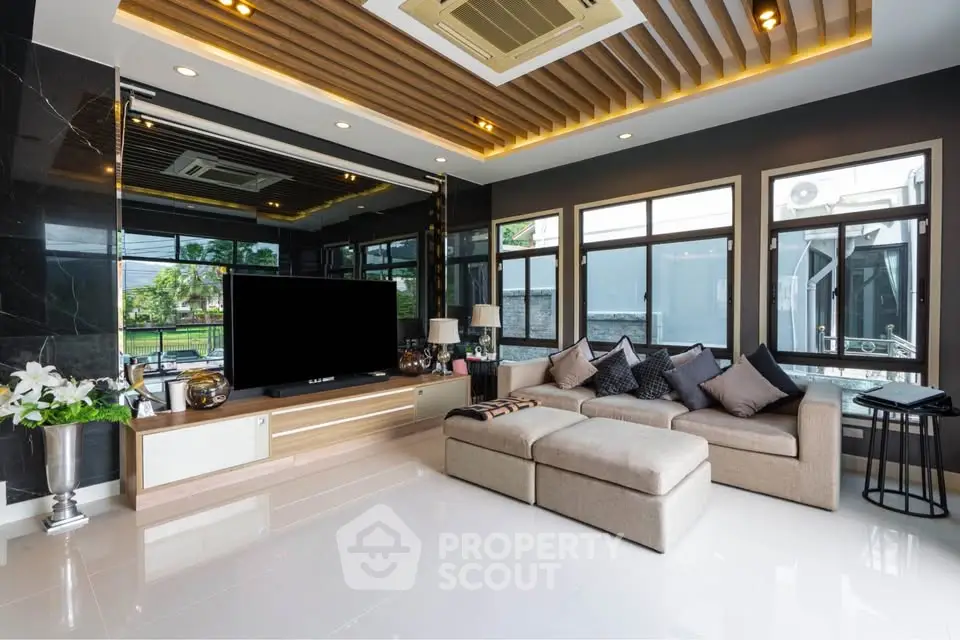 Luxurious modern living room with sleek design and ample natural light.