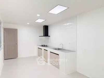 Modern minimalist kitchen with sleek design and gas stove