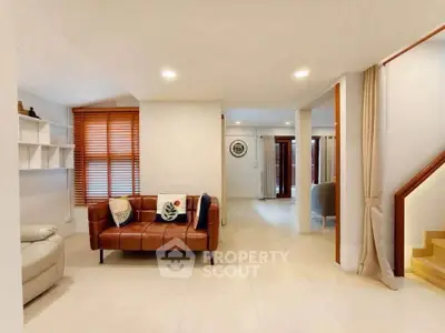 Spacious modern living room with stylish leather sofa and elegant decor
