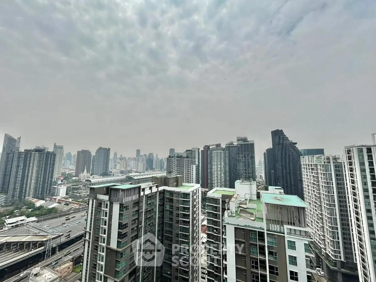 Stunning cityscape view from high-rise building showcasing urban skyline and modern architecture.