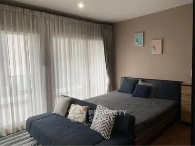 Cozy bedroom with stylish decor and natural light