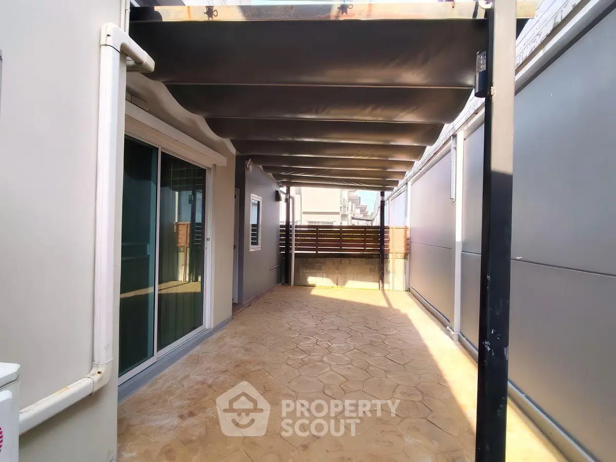 Spacious rooftop terrace with modern design and ample sunlight.