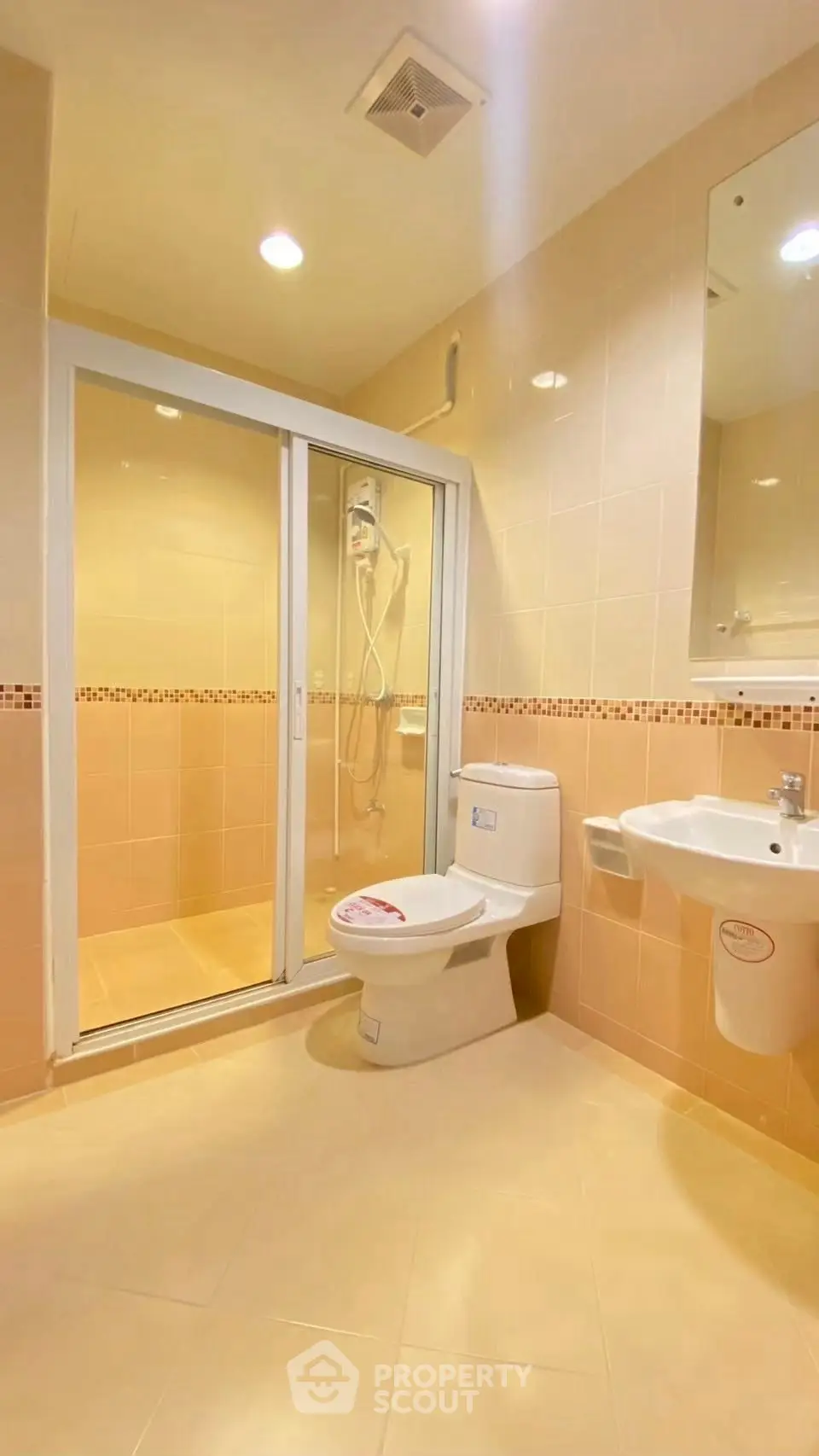 Modern bathroom with shower and sleek fixtures in a stylish apartment.