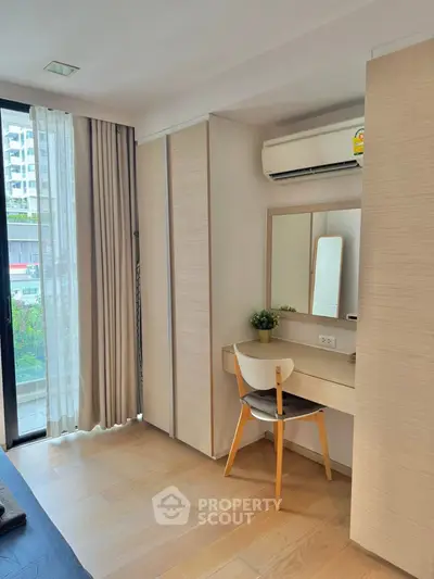 Modern bedroom with natural light and stylish wooden furniture