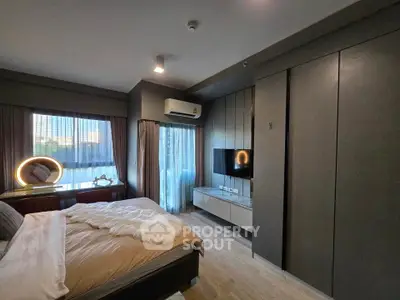 Modern bedroom with stylish decor and natural light