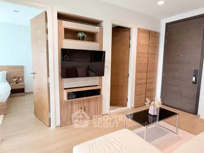 Modern living room with wooden accents and sleek TV setup in stylish apartment.
