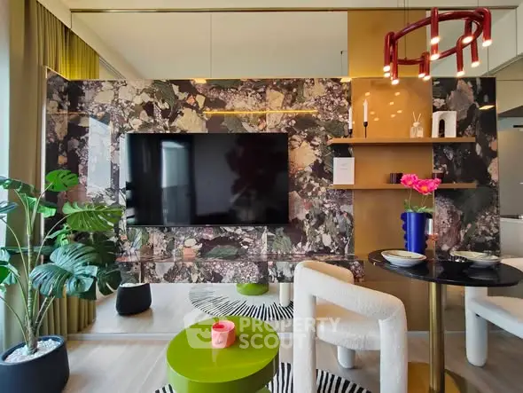 Stylish living room with modern decor, large TV, and vibrant accents