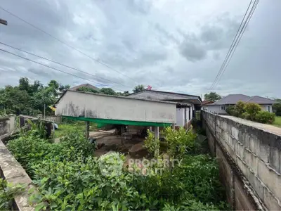 Charming suburban home with lush greenery and spacious outdoor area, perfect for family living.