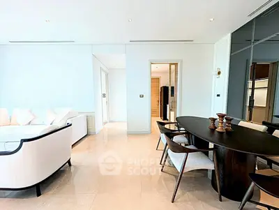 Spacious modern living room with elegant dining area and sleek furniture