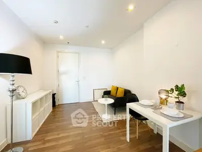 Modern living room with sleek furniture and wooden flooring