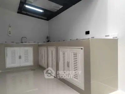Modern kitchen with sleek cabinetry and minimalist design, perfect for contemporary living.