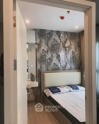 Modern bedroom with stylish decor and natural light