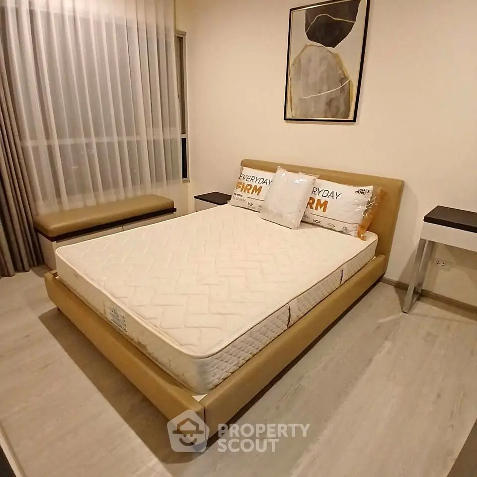 Modern bedroom with stylish decor and comfortable bed in a cozy apartment.