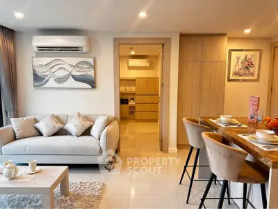 Modern open-plan living room with stylish decor and cozy seating area