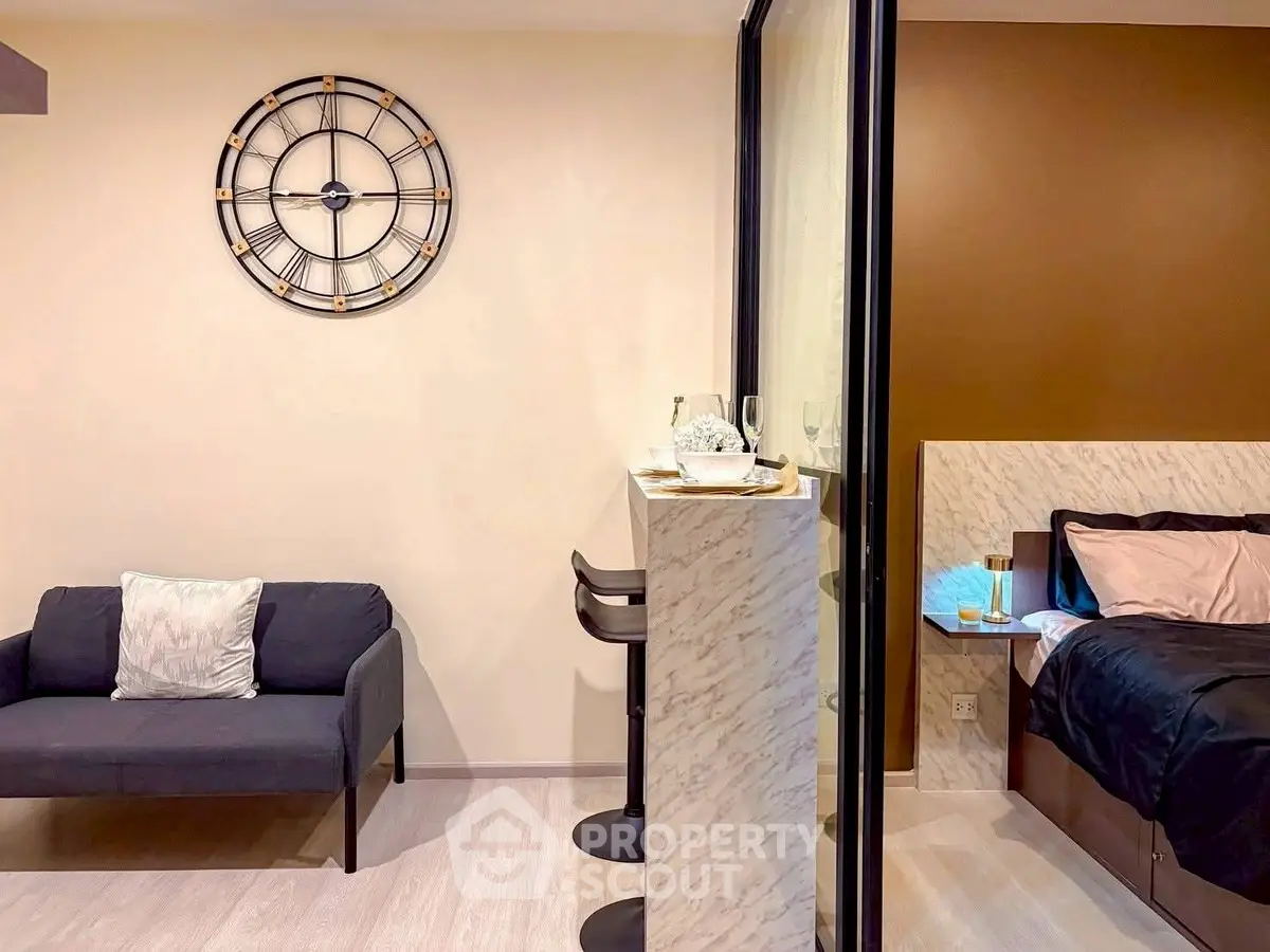 Modern studio apartment with stylish decor and cozy sleeping area