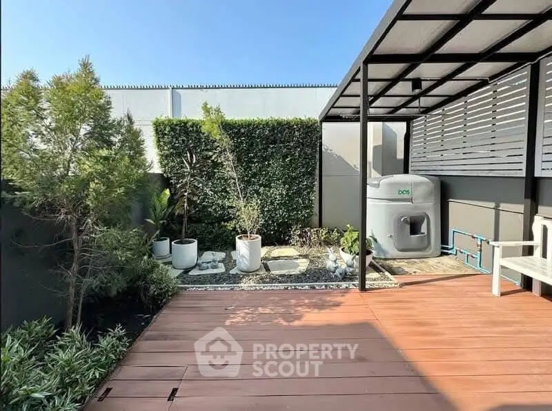 Charming garden patio with modern design and lush greenery