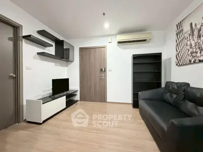 Modern living room with sleek furniture and air conditioning in a stylish apartment.