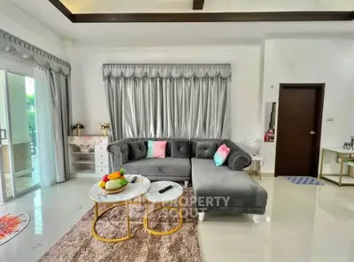 Elegant living room with plush gray sectional sofa and chic decor