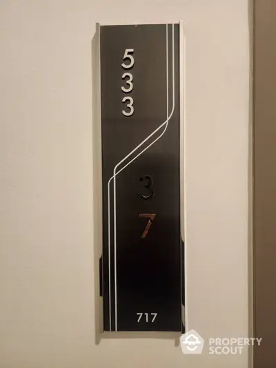 Modern apartment building floor number sign with sleek design