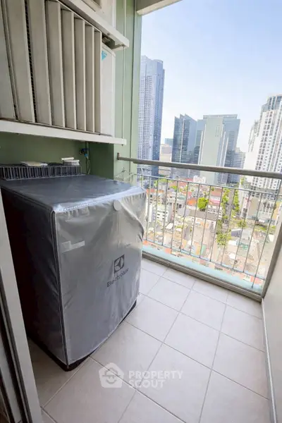 High-rise balcony with city view and washing machine, perfect for urban living.
