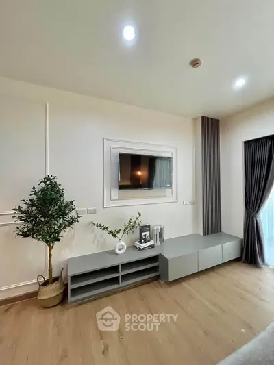 Modern living room with sleek TV setup and elegant decor