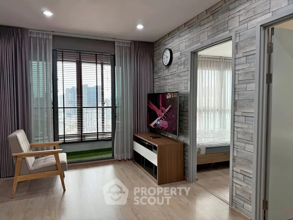 Modern living room with balcony view and stylish decor in urban apartment