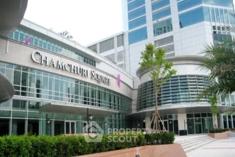 Modern commercial building exterior at Chamchuri Square with sleek glass facade.
