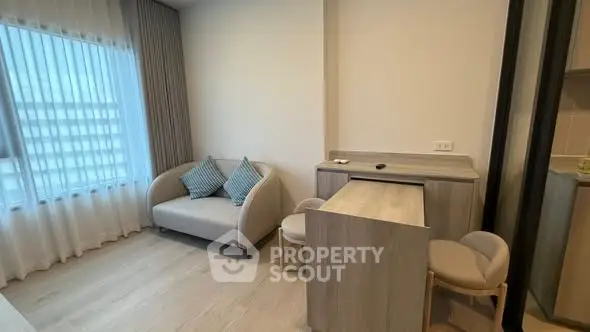 Modern living room with cozy sofa and dining area in a stylish apartment.