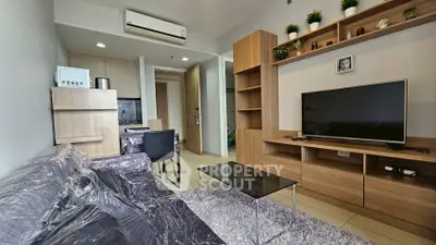 Modern living room with sleek furniture and stylish decor in a cozy apartment.