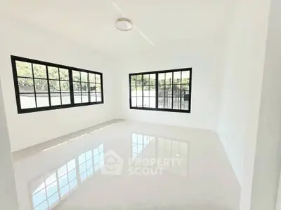 Bright and spacious empty room with large windows and glossy tiled floor, perfect for customization.
