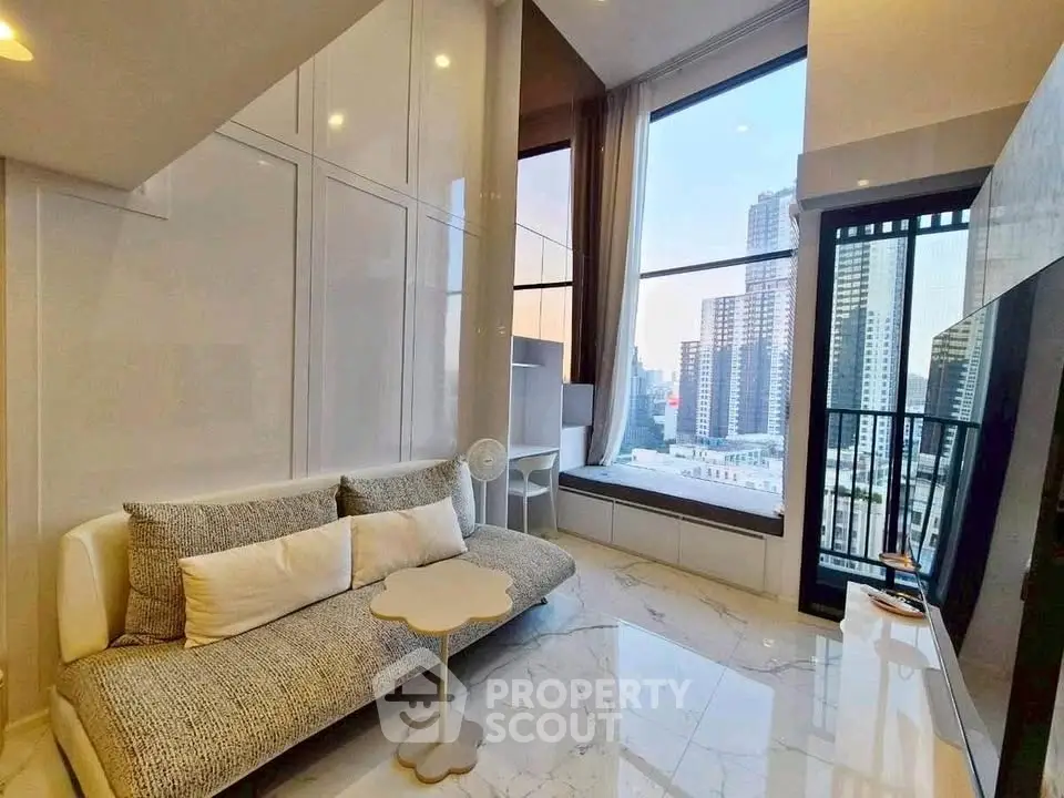 Luxurious high-rise living room with stunning city view and modern decor.