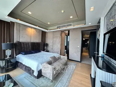 Luxurious modern bedroom with elegant decor and large windows offering stunning views.