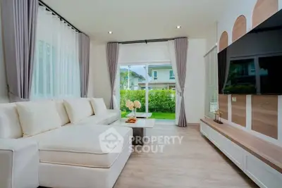 Modern living room with large windows and stylish decor