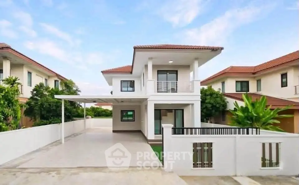 Modern two-story house with spacious driveway and contemporary design