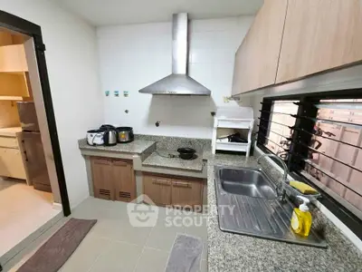 Modern kitchen with granite countertops and stainless steel appliances