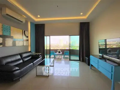 Modern living room with city view, stylish furniture, and large windows for natural light.