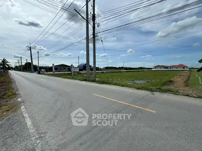 Spacious land plot with road access and scenic surroundings, ideal for development opportunities.