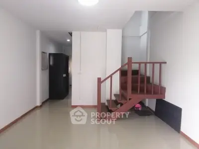Spacious interior with modern staircase and glossy flooring