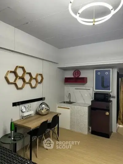 Modern compact kitchen with dining area and stylish decor