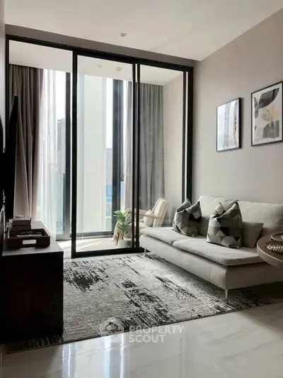 Modern living room with floor-to-ceiling windows and stylish decor