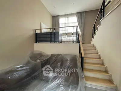 Modern duplex apartment with stylish mezzanine and sleek staircase