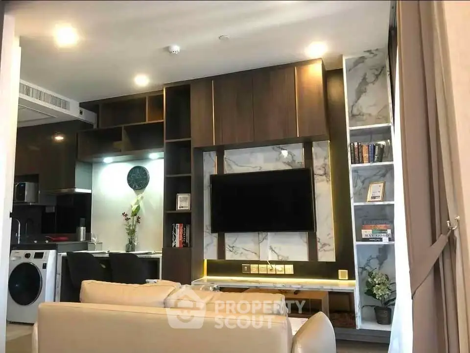 Modern living room with integrated kitchen and stylish decor