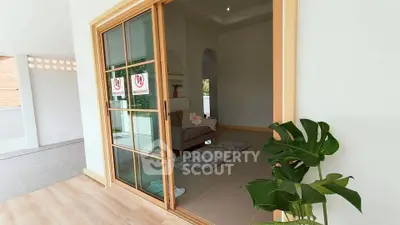 Modern living room with sliding glass doors and stylish decor