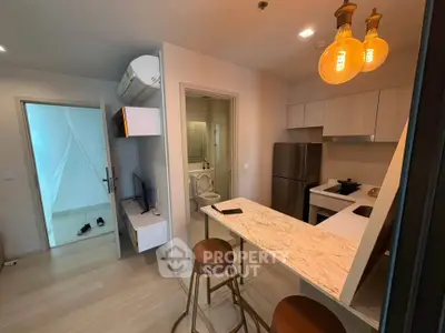Modern apartment interior with open kitchen and stylish lighting